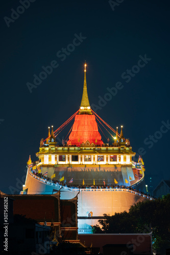 Beautiful Golden pagoda temple at night in Bangkok, Thailand