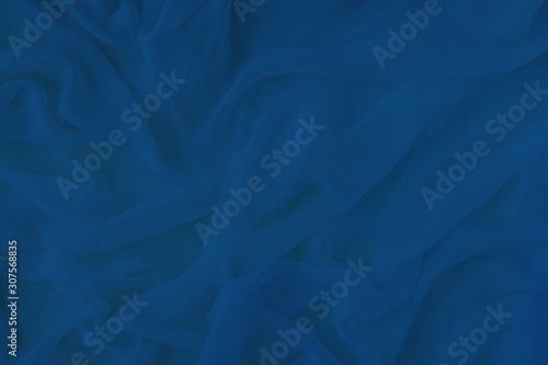 Smooth elegant classic blue gradient silk background.