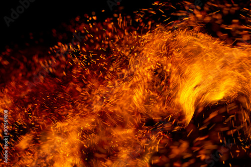 flame of fire with sparks on a black background