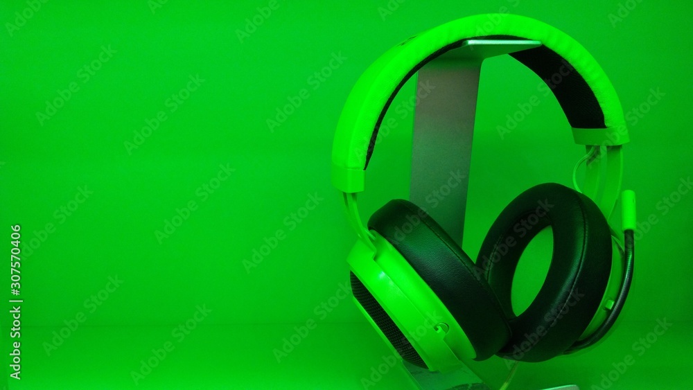 headphones on green background close up headphones on green background close up