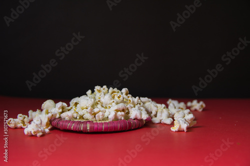 popcorn on red floor and black background © GlobalReporter
