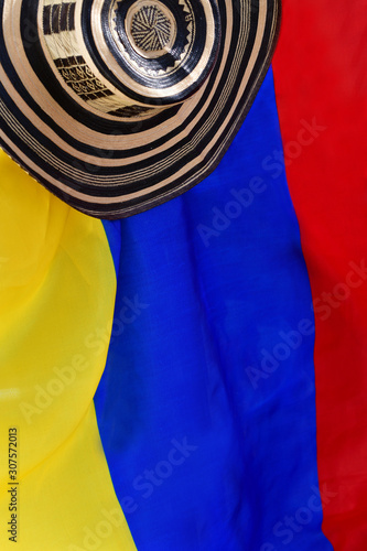  "Sombrero vueltiao"  (traditional hat from Colombia) over colombian flag