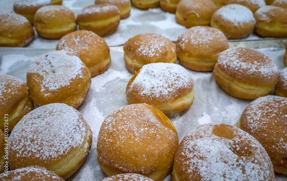 Festive sweet  donuts are traditional symbols of Hanukkah Holiday. 