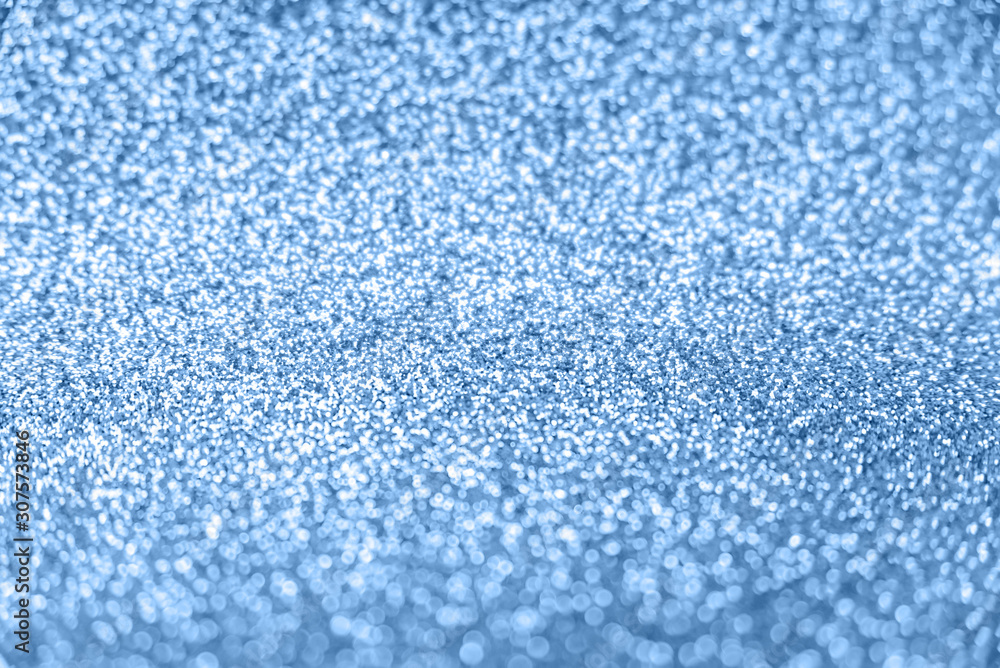 Delicate glitter bokeh background toned blue color. Delicate glitter bokeh background toned blue color.