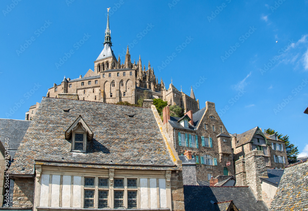 Fototapeta premium Ancient buildings of the old town on the famous Mont Saint Michel island in France