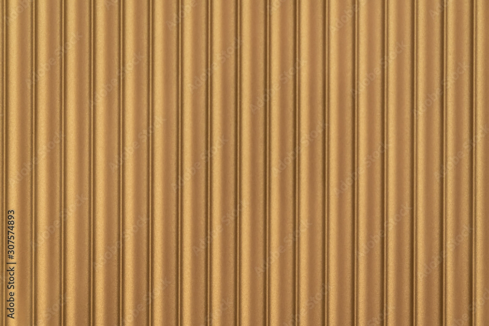Close up seamless corrugated wall covering in gold color / architecture / seamless pattern / wallpaper concept / metallic texture Close up seamless corrugated wall covering in gold color / architecture / seamless pattern / wallpaper concept / metallic texture