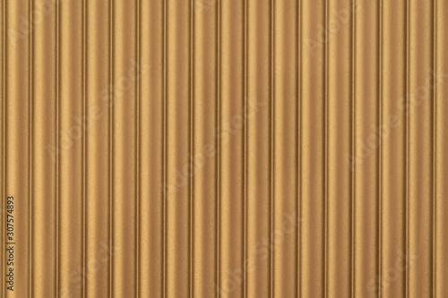 Fototapeta Naklejka Na Ścianę i Meble -  Close up seamless corrugated wall covering in gold color / architecture / seamless pattern / wallpaper concept / metallic texture