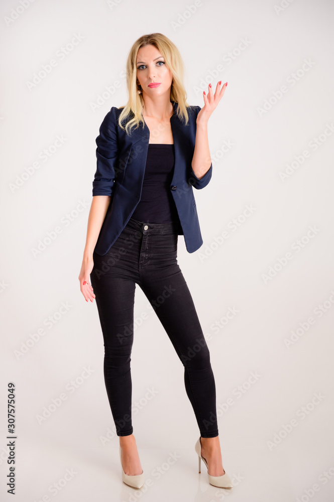 Business work concept. Full-length portrait of a pretty woman accountant - financier with excellent makeup, beautiful hair on a white background standing in front of the camera. Business work concept. Full-length portrait of a pretty woman accountant - financier with excellent makeup, beautiful hair on a white background standing in front of the camera.