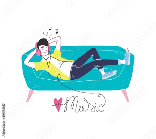 A man in headphones lies on a sofa and listens to music. Lettering love music