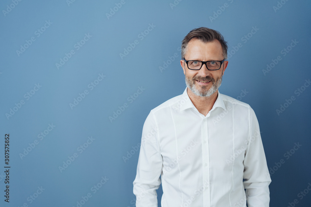 Smiling man in glasses and white shirt, copy space Smiling man in glasses and white shirt, copy space