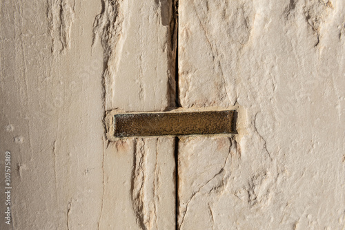 Two architectural detais fastened with a staple photo