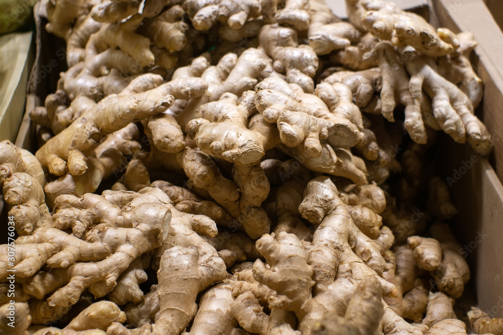 ginger root, on the shelves of a hypermarket, selling vegetables. Soft focus. Close-up ginger root, on the shelves of a hypermarket, selling vegetables. Soft focus. Close-up