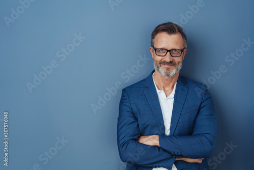 Self-assured attractive middle-aged man photo