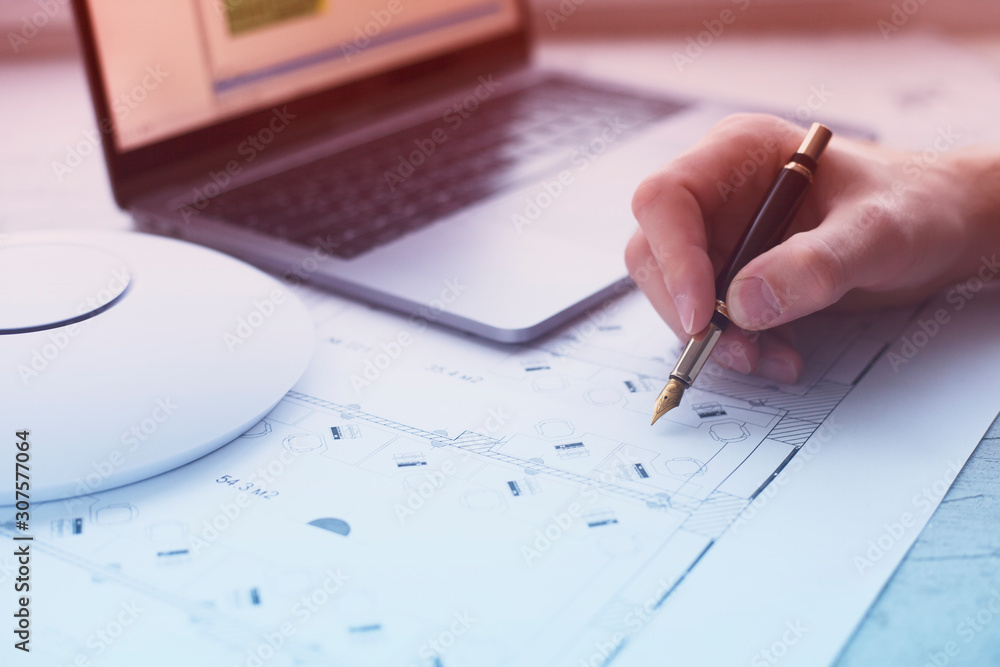 Engineering process. Man developing a network diagram for wifi access ...