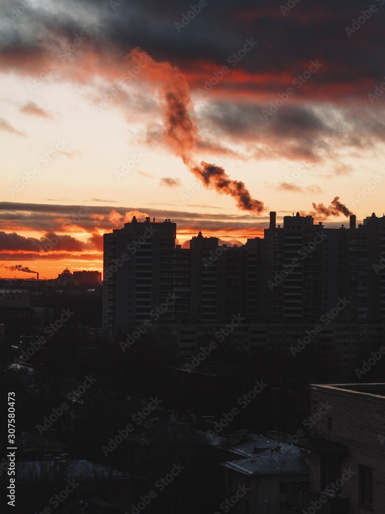 Evening winter red sky, pink sunset, panorama of the residential quarter in St. Petersburg