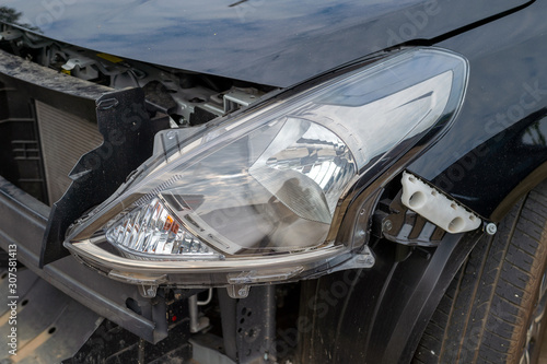 closeup car damaged from car accident with soft-focus and over light in the background