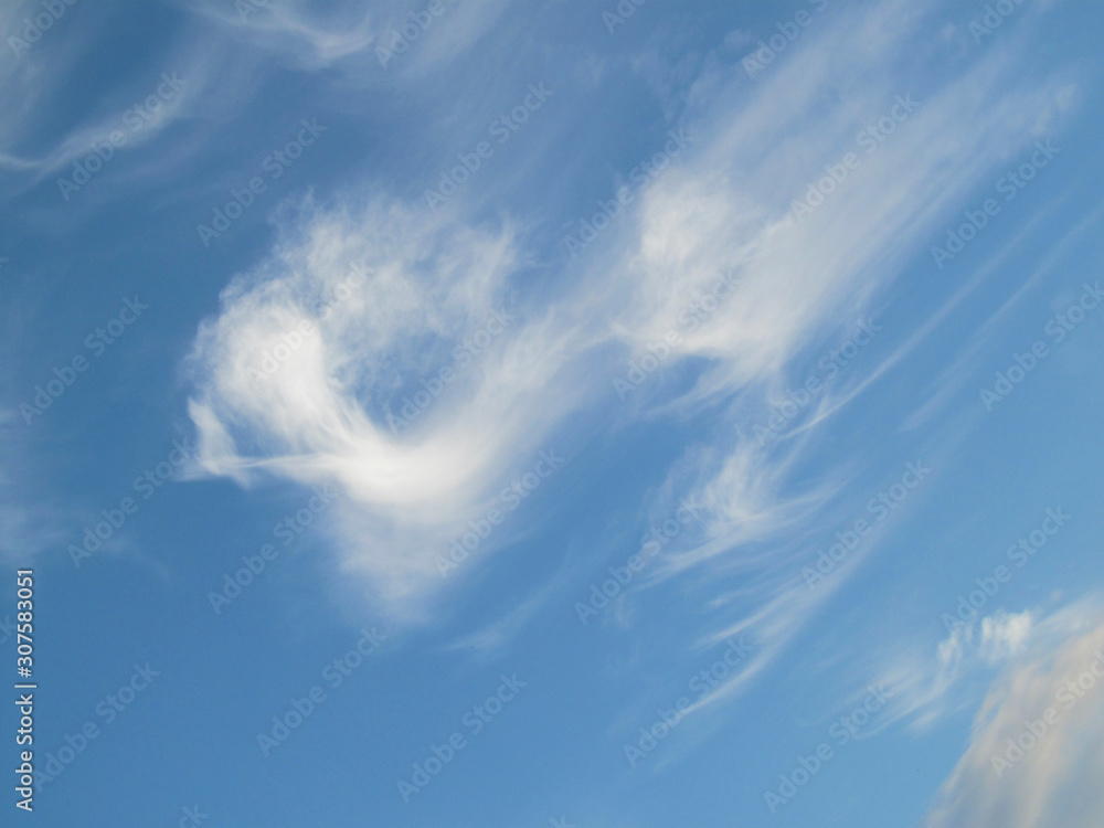 Blue sky with a white cloud running down Blue sky with a white cloud running down