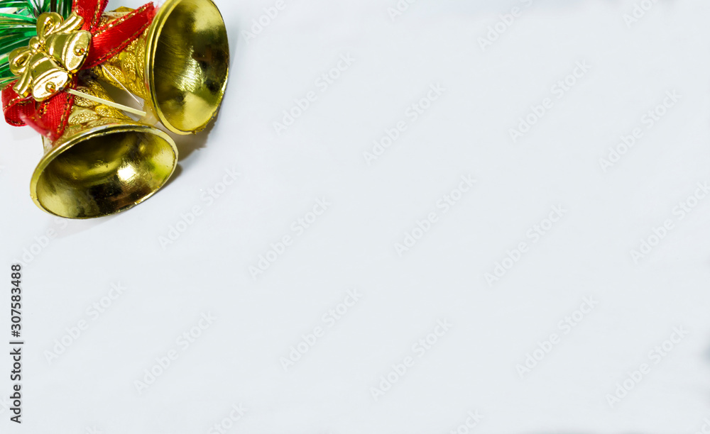 Golden bells with red ribbon for Christmas background