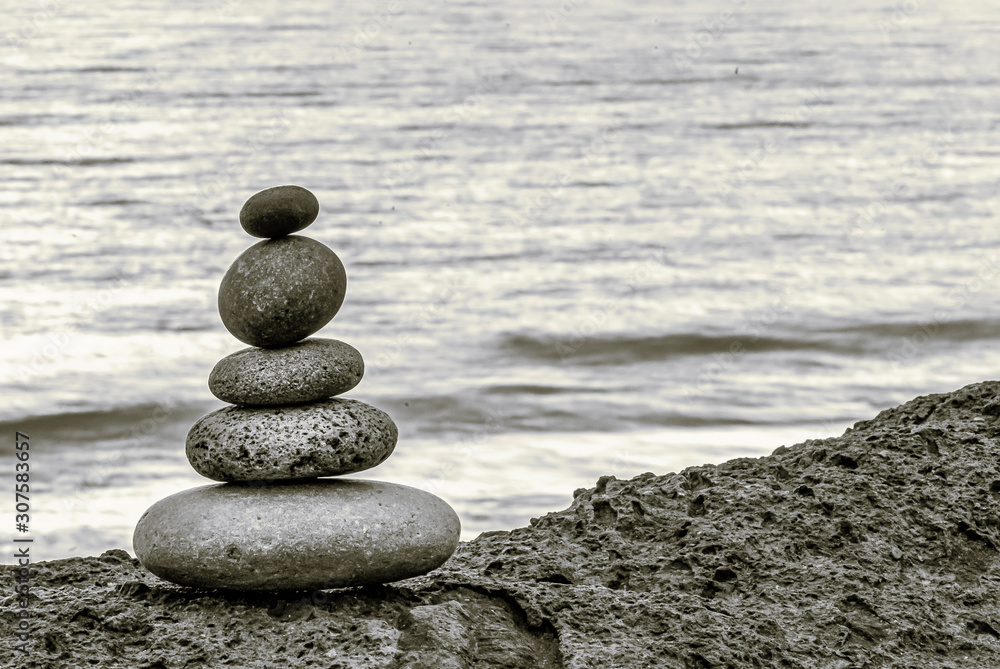 Fototapeta premium Stone Cairn On A Rock