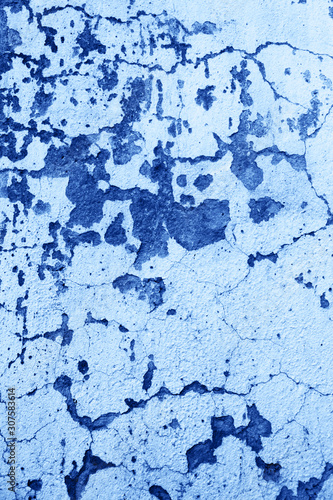colored in color of year 2020 Classic Blue background. grunge textured wall. Abstract Blue cracked wall background.