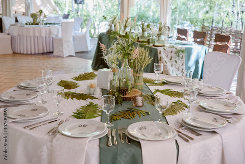 Valokuvatapetti Table setting with sparkling wineglasses and cutlery on table, copy space
