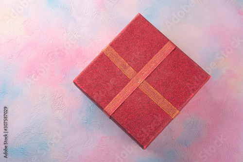 Gift box on a colored table