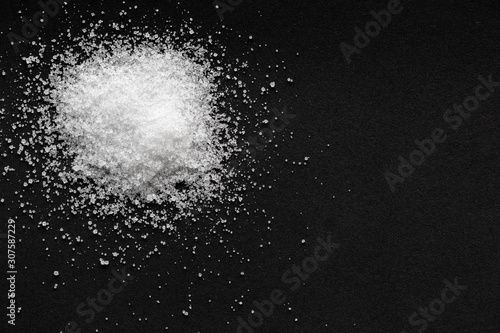 pile of sea salt on black background photo