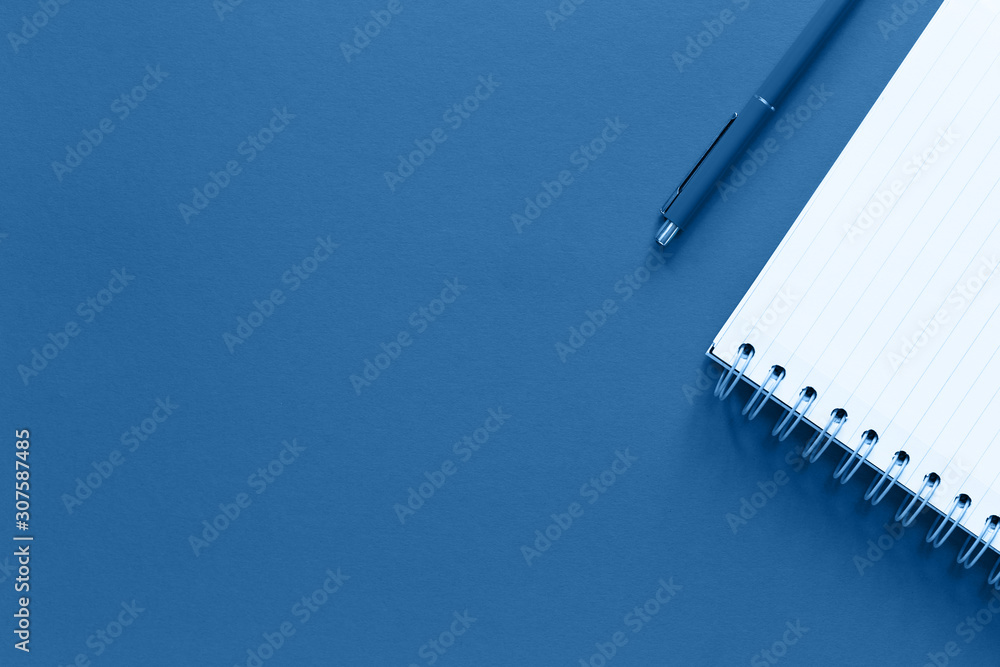 Assorted office and school white and blue stationery and notepad on pastel trendy background as border. Flat lay with copy space for back to school or education and craft concept Assorted office and school white and blue stationery and notepad on pastel trendy background as border. Flat lay with copy space for back to school or education and craft concept