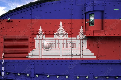 Cambodia flag depicted on side part of military armored tank closeup. Army forces conceptual background photo