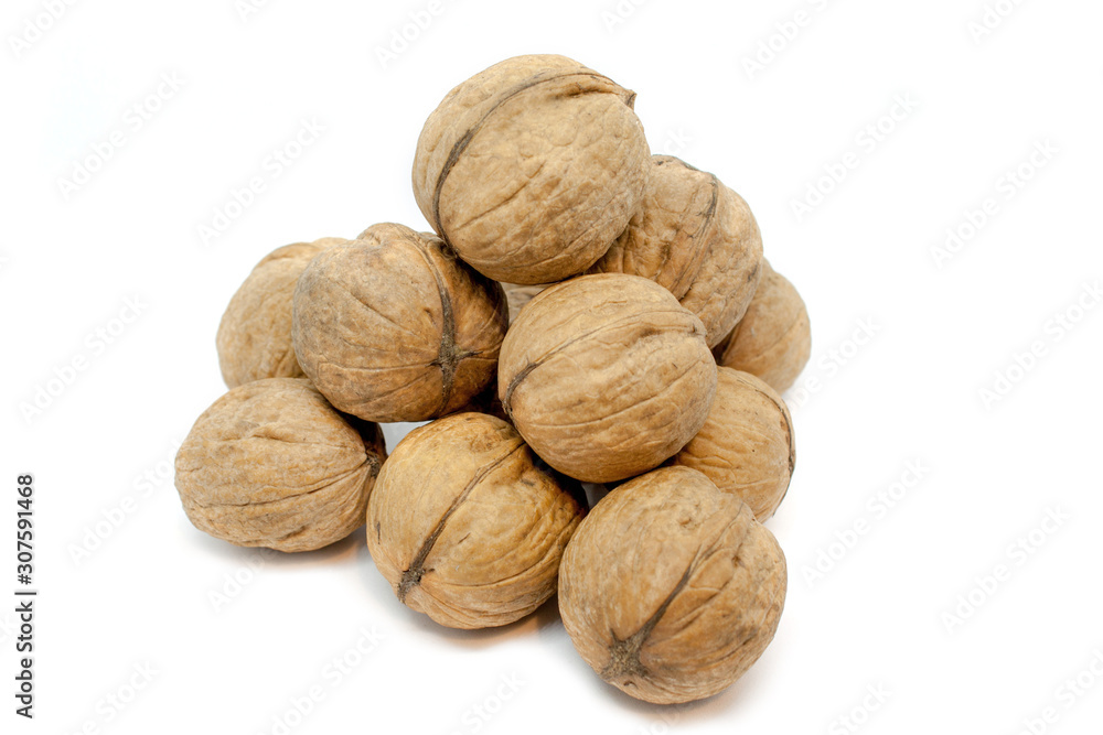 Walnut pyramid closeup on a white background. Isolated Walnut pyramid closeup on a white background. Isolated