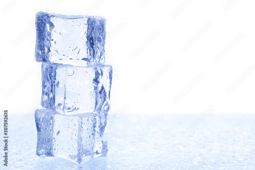 Three ice cubes on the glass. with space for text. Three ice cubes on the glass. with space for text.