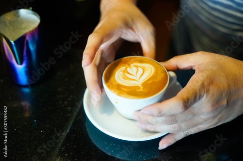 Barista doing latte art top view Milk stream
