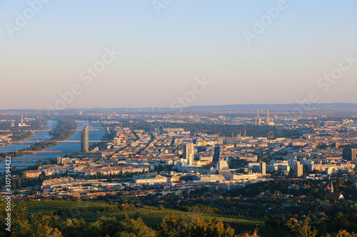 Photography Vienna, Austria - 21 September 2019: Beautiful view of the evening skyline of Vienna and Danube River with green trees of Doebling district, Austria