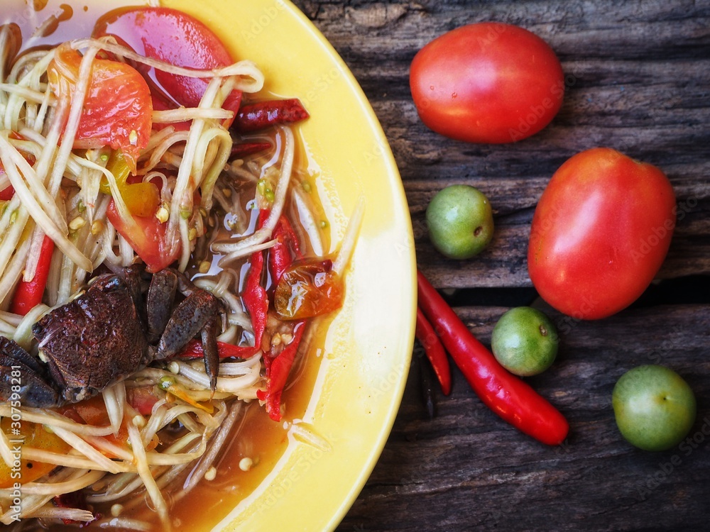 Papaya salad Thai food on wood background Papaya salad Thai food on wood background