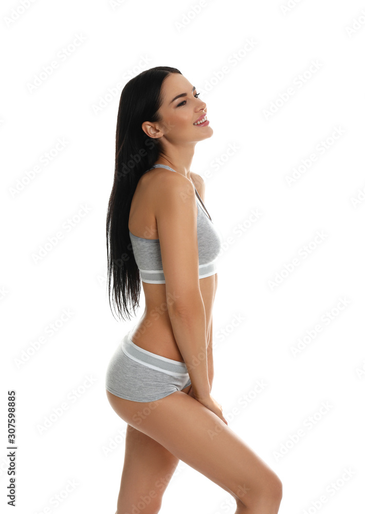 Beautiful young woman in grey sportive underwear isolated on white Beautiful young woman in grey sportive underwear isolated on white
