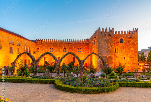 Sunset view of Archbishop palace viewed through gardens of Santa Barbara in Braga, Portugal photo