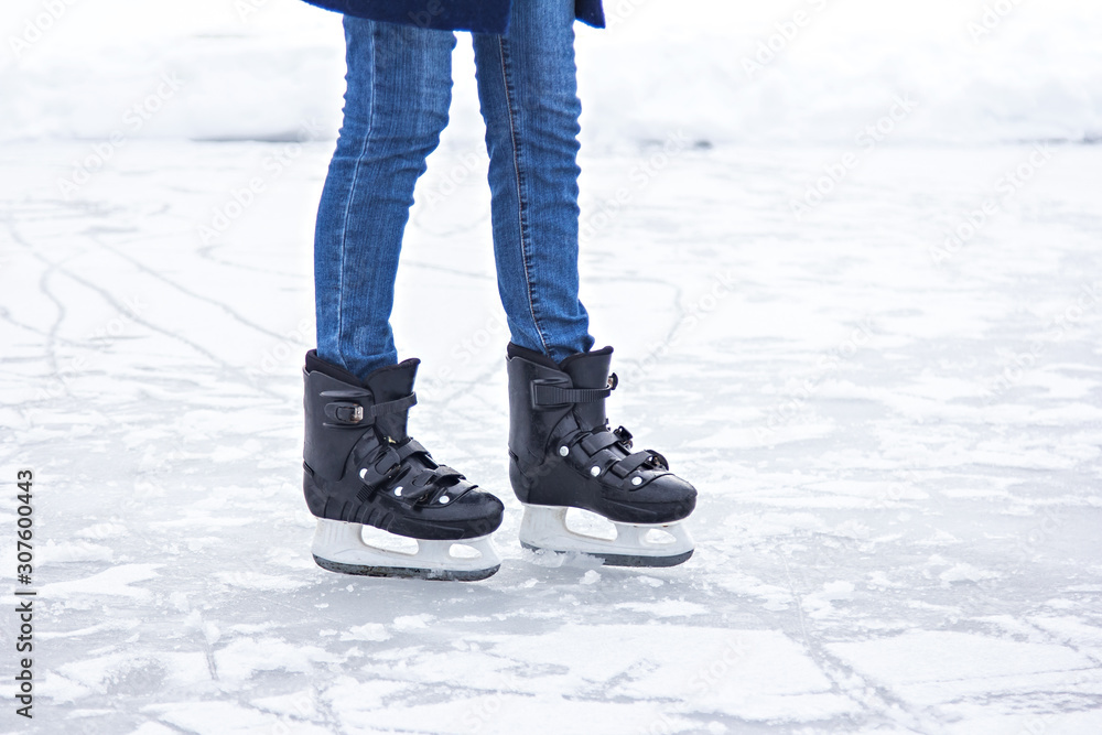 Young girl skates on ice in jeans on the nature. Young girl skates on ice in jeans on the nature.