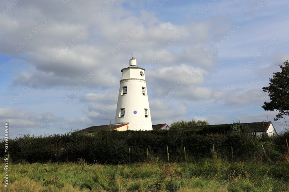 Sir Peter Scott Lighthouse, known as the East Lighthouse, River Nene, Sutton Bridge village, South Holland district, Lincolnshire, England. Sir Peter Scott Lighthouse, known as the East Lighthouse, River Nene, Sutton Bridge village, South Holland district, Lincolnshire, England.