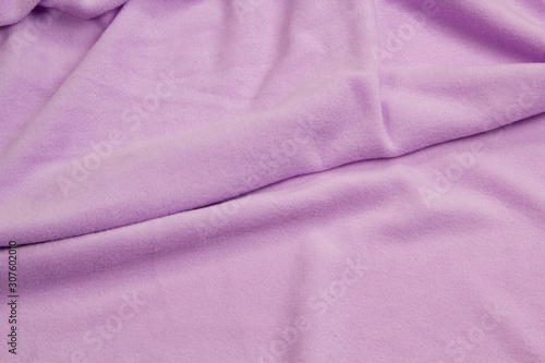Fabric fleece violet top view. Texture of textile fleece bedspread.