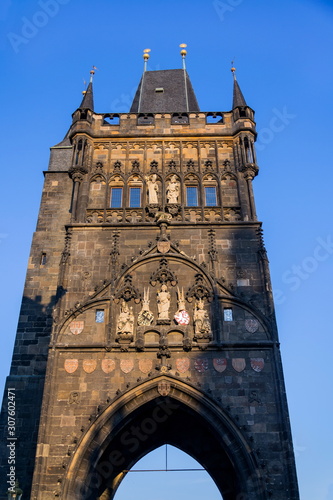 Old Town Bridge Tower guarding end of the Charles Bridge and entrance to Old Town of Prague, Czech Republic, sunny summer morning