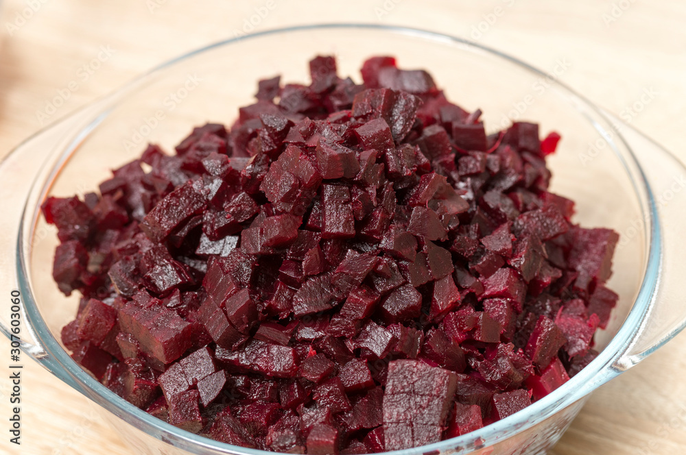 beets finely chopped close up in a transparent plate on the table beets finely chopped close up in a transparent plate on the table
