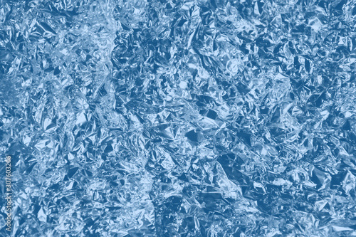 Texture foil blue classic color. Background for your design. Crumpled colored blue classic foil.