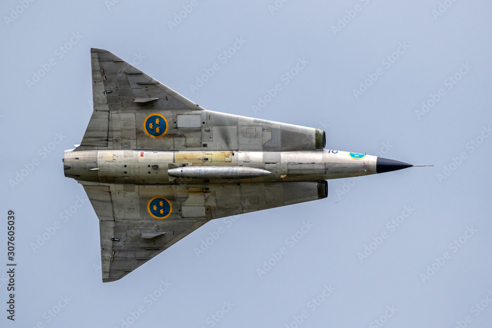 VOLKEL, NETHERLANDS - JUN 15, 2019: Vintage former Swedish Air Force Saab  Draken fighter jet plane performing a fly-by at the Dutch Air Force Days.  Stock-Foto | Adobe Stock