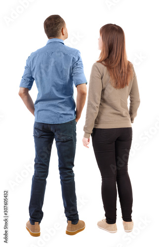 Back view of couple. beautiful friendly girl and guy together.