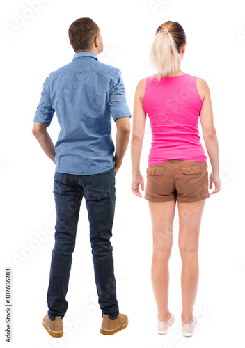 Back view of couple. beautiful friendly girl and guy together.