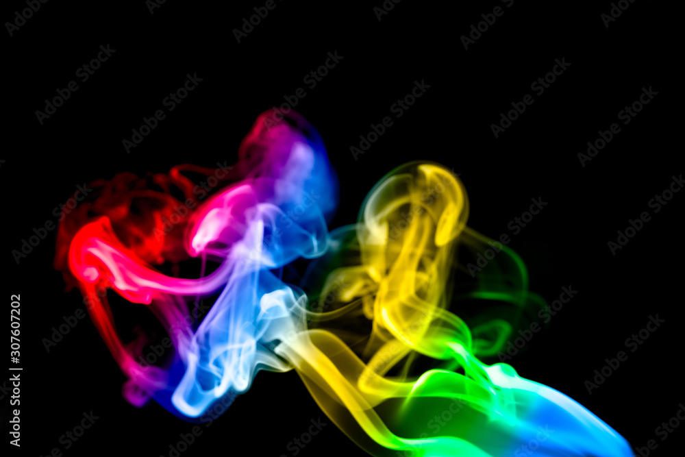 Obraz premium multicolored smoke photo aginst balck background