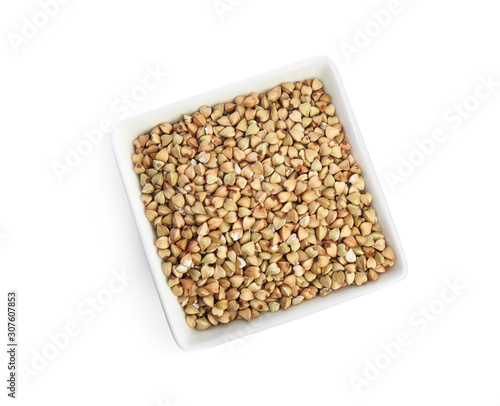 Green buckwheat in bowl isolated on white, top view