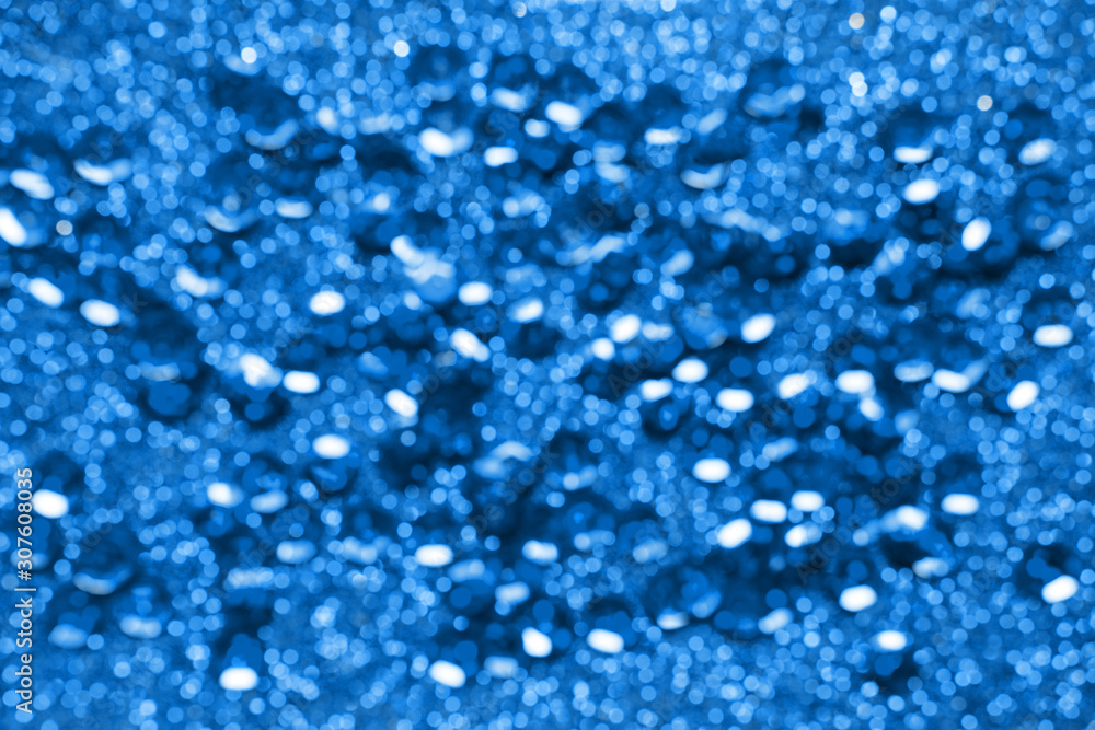 Classic blue color 2020 year, glitter and bokeh on blue festive abstract background Classic blue color 2020 year, glitter and bokeh on blue festive abstract background