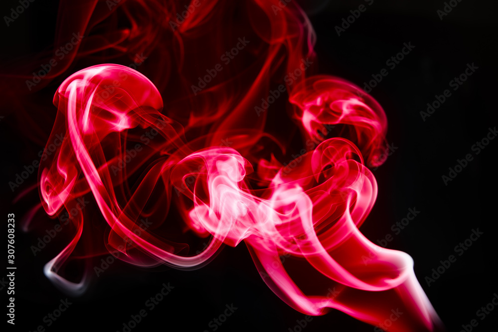 Obraz premium multicolored smoke photo against black background