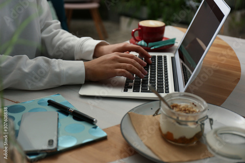 Wallpaper Mural Blogger working with laptop in cafe, closeup Torontodigital.ca